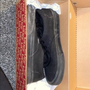 All black low rise vans